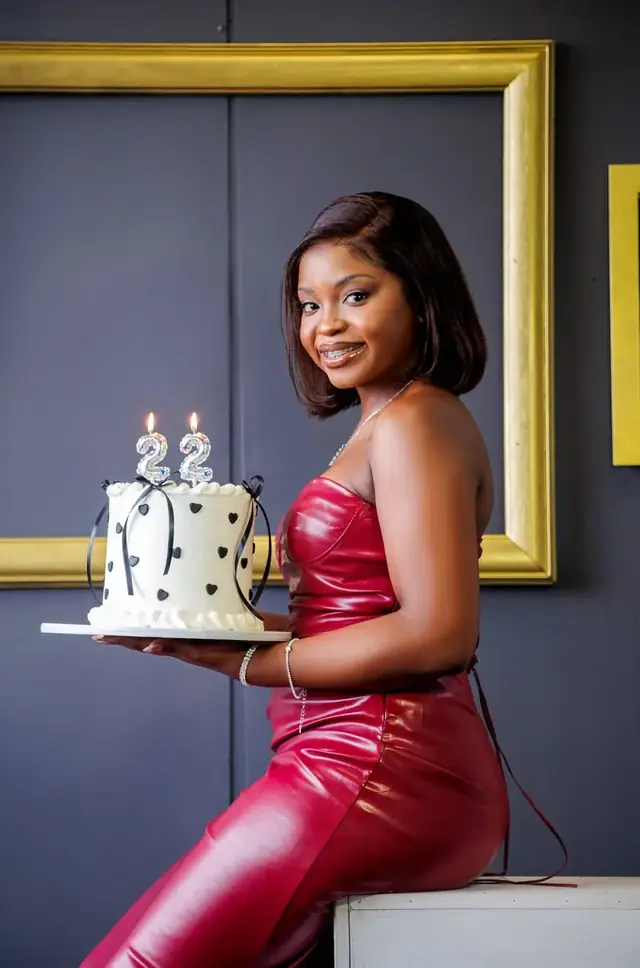 Milestone shoot in red with a cake