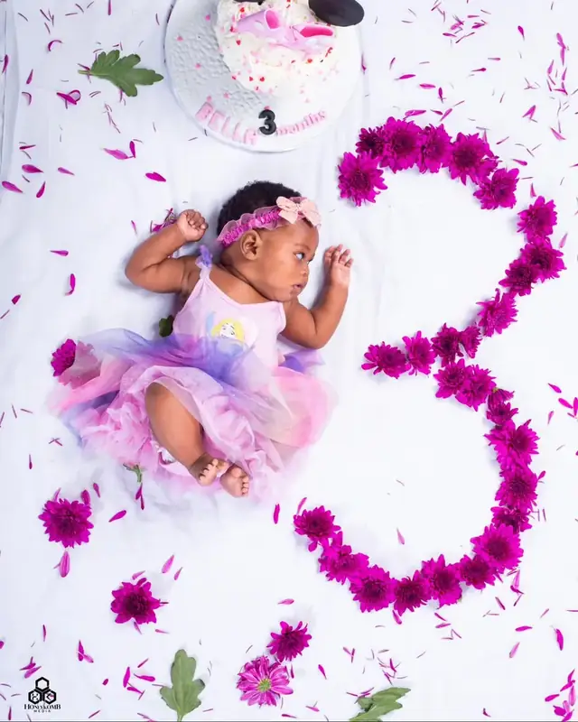 Baby milestone shoot with flower petals