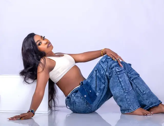 Studio portrait in denim and a crop top